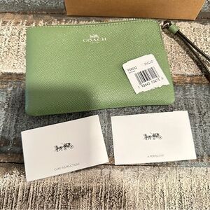 Green leather Coach Wristlet with corner zip